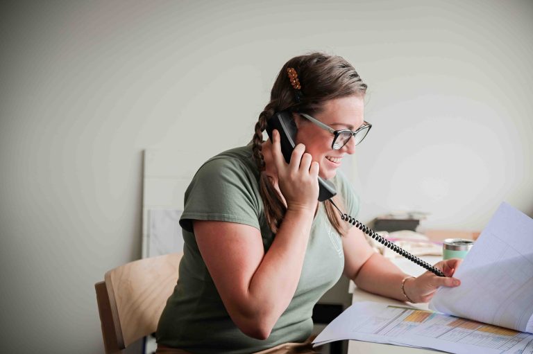 Amy calling a client